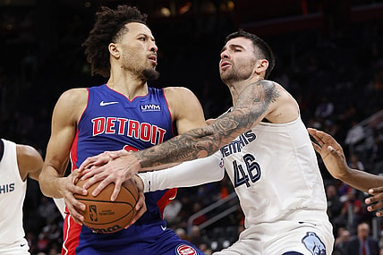 Dec 6, 2023; Detroit, Michigan, USA;  Memphis Grizzlies guard John Konchar (46) strips the ball from Detroit Pistons guard Cade Cunningham (2) in the first half at Little Caesars Arena. Mandatory Credit: Rick Osentoski-USA TODAY Sports