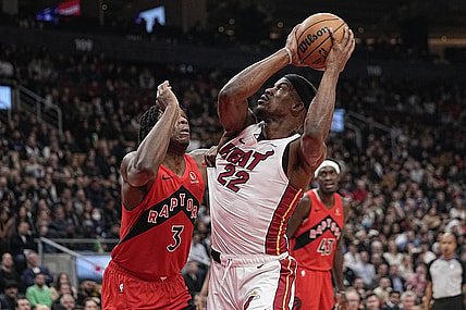 Dec 6, 2023; Toronto, Ontario, CAN; Miami Heat forward Jimmy Butler (22) tries to make a basket against Toronto Raptors forward O.G. Anunoby (3) during the first half at Scotiabank Arena. Mandatory Credit: John E. Sokolowski-USA TODAY Sports
