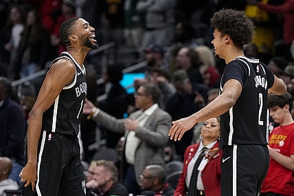 Dec 6, 2023; Atlanta, Georgia, USA; Brooklyn Nets forward Mikal Bridges (1) reacts with forward Cameron Johnson (2) after the Nets defeated the Atlanta Hawks at State Farm Arena. Mandatory Credit: Dale Zanine-USA TODAY Sports