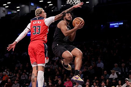 Dec 8, 2023; Brooklyn, New York, USA; Brooklyn Nets guard Cam Thomas (24) drives to the basket against Washington Wizards forward Kyle Kuzma (33) during the first quarter at Barclays Center. Mandatory Credit: Brad Penner-USA TODAY Sports