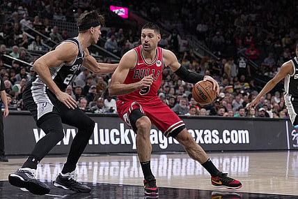 Dec 8, 2023; San Antonio, Texas, USA;  Chicago Bulls center Nikola Vucevic (9) moves against San Antonio Spurs forward Zach Collins (23) in the first half at the Frost Bank Center. Mandatory Credit: Daniel Dunn-USA TODAY Sports
