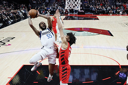 Dec 8, 2023; Portland, Oregon, USA; Dallas Mavericks small forward Derrick Jones Jr. (55) shoots the ball against Portland Trail Blazers shooting guard Shaedon Sharpe (17, right) during the first half at Moda Center. Mandatory Credit: Soobum Im-USA TODAY Sports