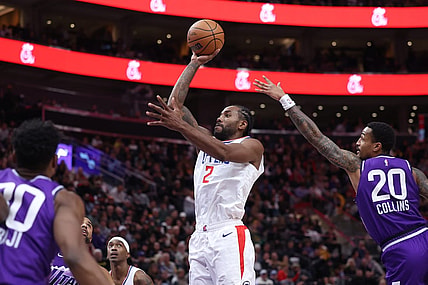 Dec 8, 2023; Salt Lake City, Utah, USA; Los Angeles Clippers forward Kawhi Leonard (2) shoots the ball past Utah Jazz forward John Collins (20) during the third quarter at Delta Center. Mandatory Credit: Rob Gray-USA TODAY Sports