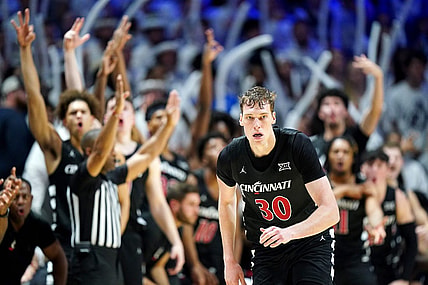 The Cincinnati Bearcats bench reacts to a made 3-point basket by Cincinnati Bearcats forward Viktor Lakhin (30) in the first half of the 91st Crosstown Shootout basketball game between the Cincinnati Bearcats and the Xavier Musketeers, Saturday, Dec. 9, 2023, at Cintas Center in Cincinnati. The Xavier Musketeers won, 84-79.