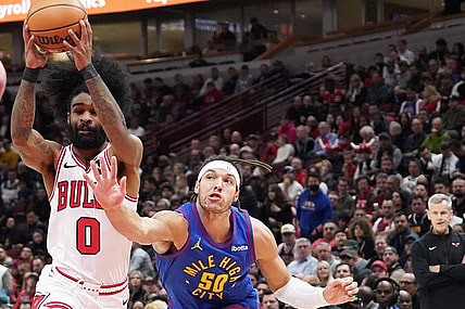 Dec 12, 2023; Chicago, Illinois, USA; Denver Nuggets forward Aaron Gordon (50) defends Chicago Bulls guard Coby White (0) during the first half at United Center. Mandatory Credit: David Banks-USA TODAY Sports