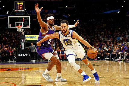 Dec 12, 2023; Phoenix, Arizona, USA; Golden State Warriors guard Stephen Curry (30) drives to the basket against Phoenix Suns guard Jordan Goodwin (0) during the third quarter at Footprint Center. Mandatory Credit: Mark J. Rebilas-USA TODAY Sports