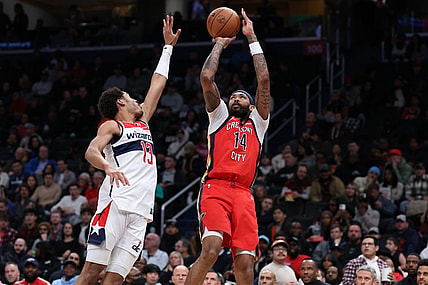 Dec 13, 2023; Washington, District of Columbia, USA; New Orleans Pelicans forward Brandon Ingram (14) shoots the ball over Washington Wizards guard Jordan Poole (13) in the third quarter at Capital One Arena. Mandatory Credit: Geoff Burke-USA TODAY Sports