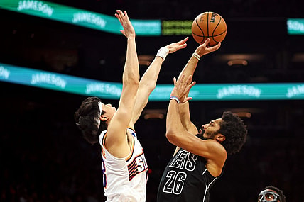 Dec 13, 2023; Phoenix, Arizona, USA; Brooklyn Nets guard Spencer Dinwiddie (26) shoots the ball against Phoenix Suns forward Yuta Watanabe (18) during the second quarter at Footprint Center. Mandatory Credit: Mark J. Rebilas-USA TODAY Sports