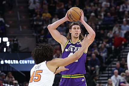 Dec 13, 2023; Salt Lake City, Utah, USA; Utah Jazz forward Kelly Olynyk (41) looks to pass the ball against New York Knicks center Jericho Sims (45) during the third quarter at Delta Center. Mandatory Credit: Rob Gray-USA TODAY Sports