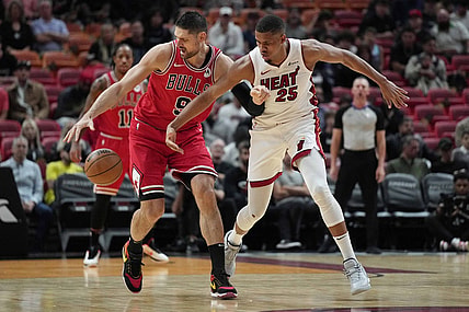 Dec 14, 2023; Miami, Florida, USA; Chicago Bulls center Nikola Vucevic (9) intercepts a pass intended for Miami Heat center Orlando Robinson (25) during the first half at Kaseya Center. Mandatory Credit: Jim Rassol-USA TODAY Sports