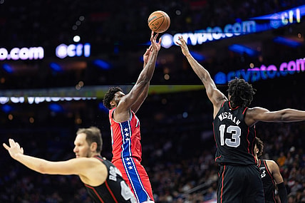 Dec 15, 2023; Philadelphia, Pennsylvania, USA; Philadelphia 76ers center Joel Embiid (21) shoots past Detroit Pistons center James Wiseman (13) during the second quarter at Wells Fargo Center. Mandatory Credit: Bill Streicher-USA TODAY Sports