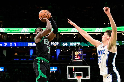 Dec 15, 2023; Boston, Massachusetts, USA; Boston Celtics guard Jaylen Brown (7) shoots the ball over Orlando Magic forward Franz Wagner (22) during the second half at TD Garden. Mandatory Credit: Eric Canha-USA TODAY Sports