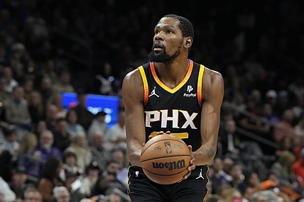 Dec 15, 2023; Phoenix, Arizona, USA; Phoenix Suns forward Kevin Durant (35) shoots a technical foul against the New York Knicks in the first half at Footprint Center. Mandatory Credit: Rick Scuteri-USA TODAY Sports