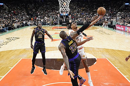 Dec 15, 2023; San Antonio, Texas, USA; San Antonio Spurs guard Devin Vassell (24) drives to the basket against Los Angeles Lakers forward LeBron James (23) during the second half at Frost Bank Center. Mandatory Credit: Scott Wachter-USA TODAY Sports