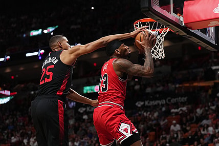 Dec 16, 2023; Miami, Florida, USA; Miami Heat center Orlando Robinson (25) fouls Chicago Bulls forward Torrey Craig (13) during the first half at Kaseya Center. Mandatory Credit: Jasen Vinlove-USA TODAY Sports