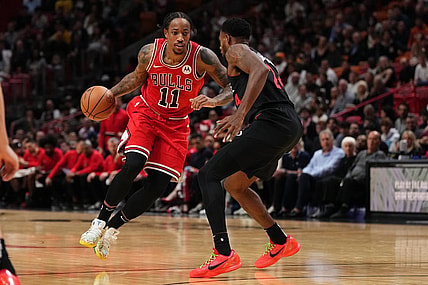 Dec 16, 2023; Miami, Florida, USA; Chicago Bulls forward DeMar DeRozan (11) drives the ball around Miami Heat forward Haywood Highsmith (24) during the first half at Kaseya Center. Mandatory Credit: Jasen Vinlove-USA TODAY Sports