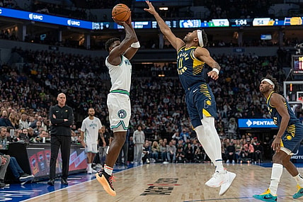 Dec 16, 2023; Minneapolis, Minnesota, USA; Minnesota Timberwolves guard Anthony Edwards (5) hits a three point basket defended by Indiana Pacers forward Bruce Brown (11) in the second quarter at Target Center. Mandatory Credit: Matt Blewett-USA TODAY Sports