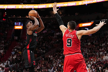 Dec 16, 2023; Miami, Florida, USA; Miami Heat forward Jimmy Butler (22) shoots over Chicago Bulls center Nikola Vucevic (9) during the second half at Kaseya Center. Mandatory Credit: Jasen Vinlove-USA TODAY Sports