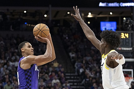 December 16, 2023; Sacramento, California, USA; Sacramento Kings forward Keegan Murray (13) shoots the basketball against Utah Jazz forward Taylor Hendricks (0) during the third quarter at Golden 1 Center. Mandatory Credit: Kyle Terada-USA TODAY Sports