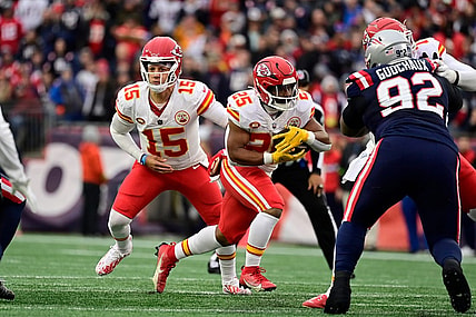 Dec 17, 2023; Foxborough, Massachusetts, USA; Kansas City Chiefs quarterback Patrick Mahomes (15) hands the ball off to running back Clyde Edwards-Helaire (25) during the first half against the New England Patriots at Gillette Stadium. Mandatory Credit: Eric Canha-USA TODAY Sports