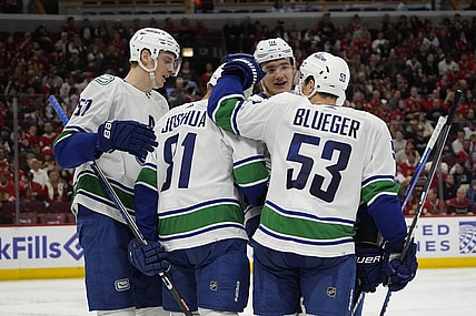 Dec 17, 2023; Chicago, Illinois, USA; Vancouver Canucks center Dakota Joshua (81) celebrates his goal against the Chicago Blackhawks during the second period at United Center. Mandatory Credit: David Banks-USA TODAY Sports