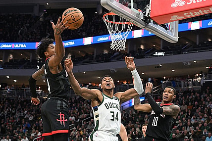 Dec 17, 2023; Milwaukee, Wisconsin, USA; Milwaukee Bucks forward Giannis Antetokounmpo (34) battles for a rebound with Houston Rockets guard Jalen Green (4) in the first half at Fiserv Forum. Mandatory Credit: Michael McLoone-USA TODAY Sports