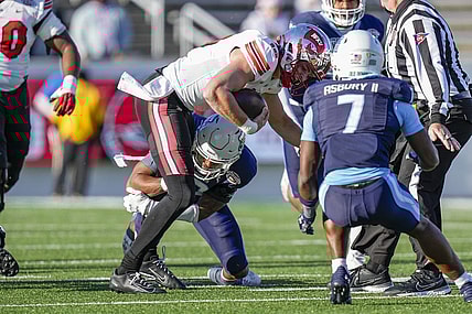 Dec 18, 2023; Charlotte, NC, USA; Western Kentucky Hilltoppers quarterback Caden Veltkamp (10) runs the ball against the Old Dominion Monarchs during the first quarter at Charlotte 49ers' Jerry Richardson Stadium. Mandatory Credit: Jim Dedmon-USA TODAY Sports