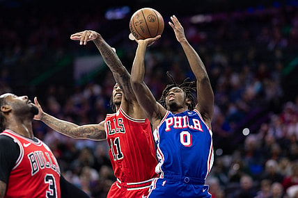 Dec 18, 2023; Philadelphia, Pennsylvania, USA; Philadelphia 76ers guard Tyrese Maxey (0) drives for a shot against Chicago Bulls forward DeMar DeRozan (11) during the second quarter at Wells Fargo Center. Mandatory Credit: Bill Streicher-USA TODAY Sports