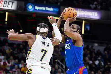 Dec 18, 2023; Indianapolis, Indiana, USA; LA Clippers guard James Harden (1) shoots the ball while Indiana Pacers guard Buddy Hield (7) defends in the first half at Gainbridge Fieldhouse. Mandatory Credit: Trevor Ruszkowski-USA TODAY Sports