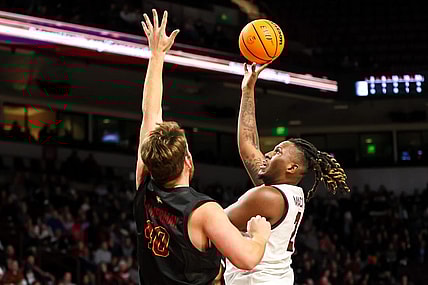 Dec 19, 2023; Columbia, South Carolina, USA; South Carolina Gamecocks forward B.J. Mack (2) shoots over Winthrop Eagles center Alex Timmerman (40) in the first half at Colonial Life Arena. Mandatory Credit: Jeff Blake-USA TODAY Sports