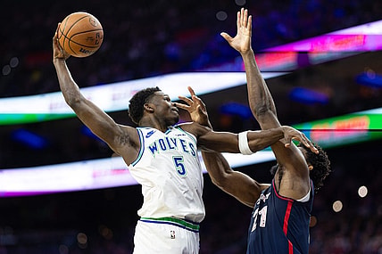 Dec 20, 2023; Philadelphia, Pennsylvania, USA; Minnesota Timberwolves guard Anthony Edwards (5) drives for a shot against Philadelphia 76ers center Joel Embiid (21) during the second quarter at Wells Fargo Center. Mandatory Credit: Bill Streicher-USA TODAY Sports