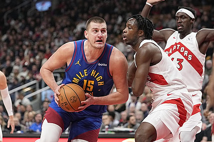 Dec 20, 2023; Toronto, Ontario, CAN; Denver Nuggets center Nikola Jokic (15) drives to the net against Toronto Raptors forward O.G. Anunoby (3) during the first half at Scotiabank Arena. Mandatory Credit: John E. Sokolowski-USA TODAY Sports