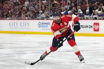 Dec 21, 2023; Sunrise, Florida, USA; Florida Panthers defenseman Aaron Ekblad (5) passes the puck against the St. Louis Blues during the second period at Amerant Bank Arena. Mandatory Credit: Jasen Vinlove-USA TODAY Sports