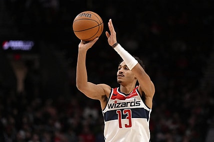 Dec 21, 2023; Portland, Oregon, USA; Washington Wizards shooting guard Jordan Poole (13) shoots the ball during the first half against the Portland Trail Blazers at Moda Center. Mandatory Credit: Soobum Im-USA TODAY Sports