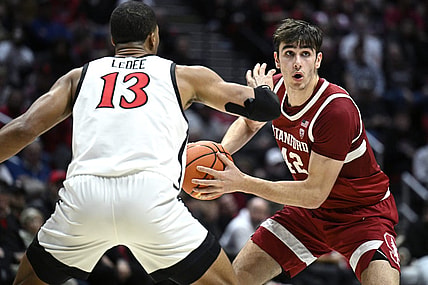 Dec 21, 2023; San Diego, California, USA; Stanford Cardinal forward Maxime Raynaud (42) looks to pass defended by San Diego State Aztecs forward Jaedon LeDee (13) during the second half at Viejas Arena. Mandatory Credit: Orlando Ramirez-USA TODAY Sports