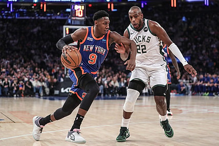 Dec 23, 2023; New York, New York, USA;  New York Knicks guard RJ Barrett (9) drives past Milwaukee Bucks forward Khris Middleton (22) in the first quarter at Madison Square Garden. Mandatory Credit: Wendell Cruz-USA TODAY Sports