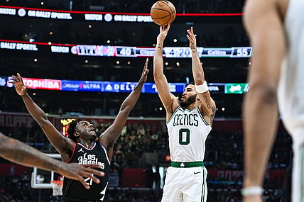 Dec 23, 2023; Los Angeles, California, USA; Boston Celtics forward Jayson Tatum (0) shoots against Los Angeles Clippers forward Kobe Brown (21) during the second quarter at Crypto.com Arena. Mandatory Credit: Jonathan Hui-USA TODAY Sports