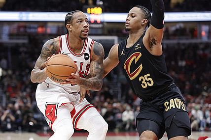 Dec 23, 2023; Chicago, Illinois, USA; Chicago Bulls forward DeMar DeRozan (11) drives to the basket against Cleveland Cavaliers forward Isaac Okoro (35) during the first half at United Center. Mandatory Credit: Kamil Krzaczynski-USA TODAY Sports