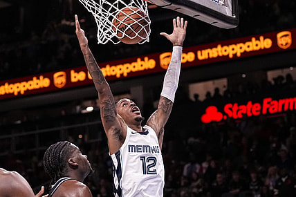 Dec 23, 2023; Atlanta, Georgia, USA; Memphis Grizzlies guard Ja Morant (12) dunks against the Atlanta Hawks during the second half  at State Farm Arena. Mandatory Credit: Dale Zanine-USA TODAY Sports