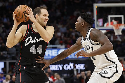 Dec 26, 2023; Detroit, Michigan, USA; Detroit Pistons forward Bojan Bogdanovic (44) is defended by Brooklyn Nets forward Dorian Finney-Smith (28) in the first half at Little Caesars Arena. Mandatory Credit: Rick Osentoski-USA TODAY Sports