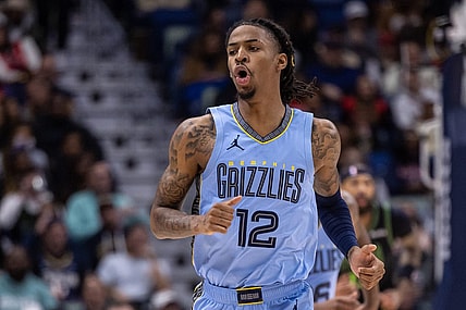Dec 26, 2023; New Orleans, Louisiana, USA; Memphis Grizzlies guard Ja Morant (12) reacts to a made basket against the New Orleans Pelicans during the first half at Smoothie King Center. Mandatory Credit: Stephen Lew-USA TODAY Sports