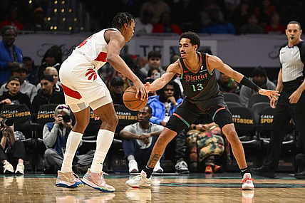 Dec 27, 2023; Washington, District of Columbia, USA; Washington Wizards guard Jordan Poole (13) defends Toronto Raptors forward Scottie Barnes (4) during the first half at Capital One Arena. Mandatory Credit: Brad Mills-USA TODAY Sports