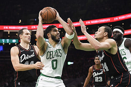 Dec 28, 2023; Boston, Massachusetts, USA;  Boston Celtics forward Jayson Tatum (0) drives to the basket while Detroit Pistons forward Kevin Knox II (24) defends during the first half at TD Garden. Mandatory Credit: Bob DeChiara-USA TODAY Sports