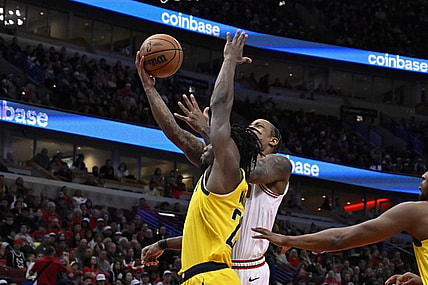 Dec 28, 2023; Chicago, Illinois, USA;  Chicago Bulls forward DeMar DeRozan (11) shoots against Indiana Pacers forward Aaron Nesmith (23)  during the first half at United Center. Mandatory Credit: Matt Marton-USA TODAY Sports