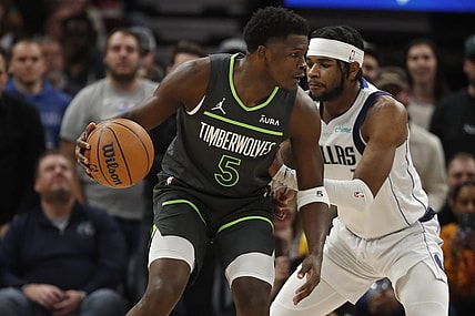 Dec 28, 2023; Minneapolis, Minnesota, USA; Minnesota Timberwolves guard Anthony Edwards (5) works around Dallas Mavericks guard Jaden Hardy (1) in the first quarter at Target Center. Mandatory Credit: Bruce Kluckhohn-USA TODAY Sports