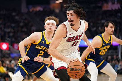Dec 28, 2023; San Francisco, California, USA; Miami Heat forward Jaime Jaquez Jr. (11) spins towards the hoop next to Golden State Warriors guard Brandin Podziemski (2) in the first quarter at the Chase Center. Mandatory Credit: Cary Edmondson-USA TODAY Sports