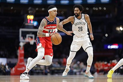 Dec 29, 2023; Washington, District of Columbia, USA; Washington Wizards forward Kyle Kuzma (33) drives to the basket as Brooklyn Nets guard Spencer Dinwiddie (26) defends in the first quarter at Capital One Arena. Mandatory Credit: Geoff Burke-USA TODAY Sports