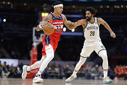 Dec 29, 2023; Washington, District of Columbia, USA; Washington Wizards forward Kyle Kuzma (33) dribbles the ball as Brooklyn Nets guard Spencer Dinwiddie (26) defends in the second quarter at Capital One Arena. Mandatory Credit: Geoff Burke-USA TODAY Sports