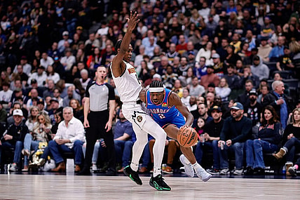 Dec 29, 2023; Denver, Colorado, USA; Oklahoma City Thunder guard Shai Gilgeous-Alexander (2) drives to the basket against Denver Nuggets forward Peyton Watson (8) in the second quarter at Ball Arena. Mandatory Credit: Isaiah J. Downing-USA TODAY Sports
