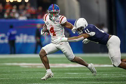 Dec 30, 2023; Atlanta, GA, USA; Mississippi Rebels running back Quinshon Judkins (4) is tackled by Penn State Nittany Lions linebacker Abdul Carter (11) in the first quarter at Mercedes-Benz Stadium. Mandatory Credit: Brett Davis-USA TODAY Sports